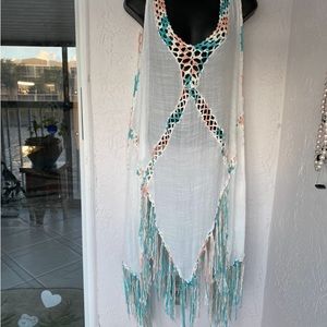 New designer, swim cover-up. Trimmed in crocheted colors aqua peach, and white.